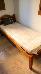 Cama ou camas em um quarto em Caminhos do Mar Hostel
