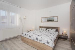 Ένα ή περισσότερα κρεβάτια σε δωμάτιο στο Apartman Carpe Diem Šibenik +29 φωτογραφίες