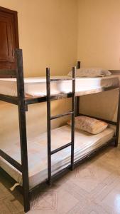 Cama ou camas em um quarto em Caminhos do Mar Hostel