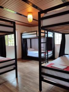 Postel nebo postele na pokoji v ubytování Maracuya Hostel