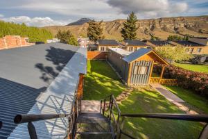 a view of a house from the balcony of a house at hosteria las cachi alojamiento in Esquel