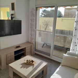 TV a/nebo společenská místnost v ubytování "EL RINCON" naturist boutique apartment