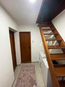a small kitchen with a staircase in a room at Vikendica Vukovic in Foča