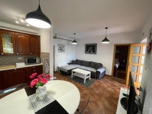 a living room with a couch and a table at Pr šterni - Hrvatini 187 Ankaran in Ankaran