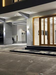 a garage with glass doors in a parking lot at Summo bilding in Jeddah +43 photos
