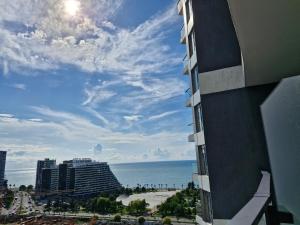 a view of the ocean from a building at Luxury Studio See view-Batumi New Boulevard -white S 1412 in Batumi +2 photos