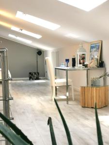 a living room with a table and a chair at WhiteHome in Conegliano