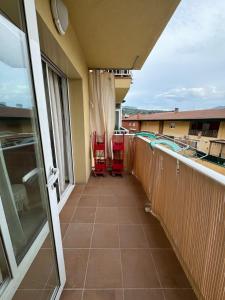 a balcony with two chairs and a swimming pool at Costapera in La Pobla de Segur