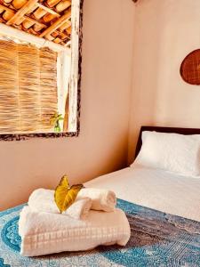 Ένα ή περισσότερα κρεβάτια σε δωμάτιο στο Pousada Jardim da Praça