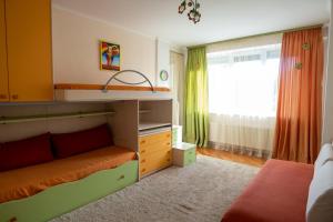 Postel nebo postele na pokoji v ubytování Puskin Hills Apartment
