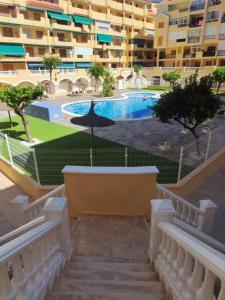 an external view of a building with a swimming pool at Casa Marius in La Mata