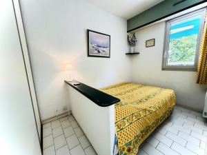 Posteľ alebo postele v izbe v ubytovaní Villegiales Tee1 - Appartement climatisé dans résidence avec piscine MAE-1104