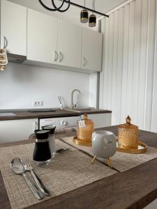 a kitchen with a table with two cakes on it at Studio Saturn Seven Palms in Saturn