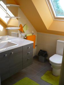 a bathroom with a sink and a toilet at gite la bretonne in Plouha