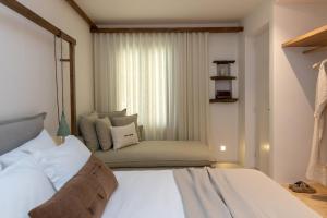 a bedroom with a large bed and a window at casa eterna in Agios Romanos