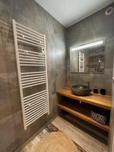 a bathroom with a sink and a mirror at Maison FlaCeLo in Locquirec +16 photos