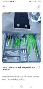 a drawer filled with scissors and other kitchen utensils at Felix Appartment H1a in Koblenz