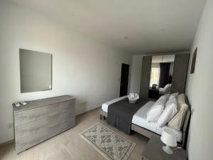 Llit o llits en una habitació de Seaview Setters Studio Apartment