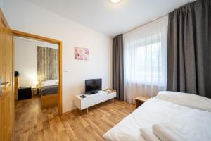 Postel nebo postele na pokoji v ubytování Penzion Dobík Pasečná