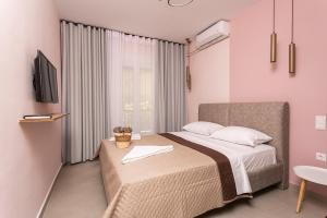 Postel nebo postele na pokoji v ubytování N37 Suite