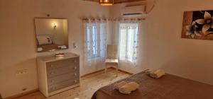 Ένα ή περισσότερα κρεβάτια σε δωμάτιο στο Filippos Home +27 φωτογραφίες