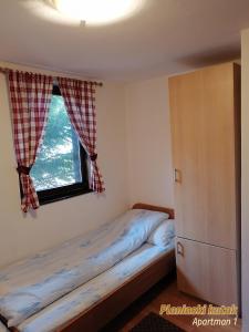 Postel nebo postele na pokoji v ubytování PLANINSKI KUTAK Tara - Apartman 1
