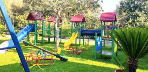 a playground with a bunch of slides and swings at Hotel Residence Il Rifugio in Palinuro