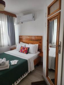 Postel nebo postele na pokoji v ubytování merih butik hotel