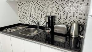 Dapur atau dapur kecil di Eloise II, excelente ubicación y con todo lo que necesitas!