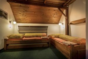 Postel nebo postele na pokoji v ubytování Penzion U Sovy