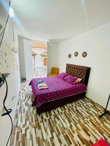 Postel nebo postele na pokoji v ubytování Hostal Badillo SV