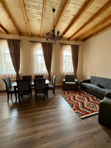a large living room with a table and chairs at Hakobyan 84 Guest House Gyumri in Gyumri