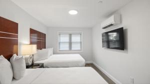 Ένα ή περισσότερα κρεβάτια σε δωμάτιο στο Safari Apartments