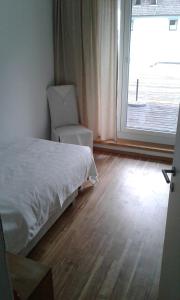 A bed or beds in a room at Fewo Ossiach