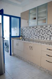 Köök või kööginurk majutusasutuses Super appartement vue sur piscine et la plage