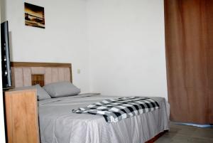 Voodi või voodid majutusasutuse Super appartement vue sur piscine et la plage toas