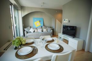 a living room with a table and a couch at Elly in Ankaran