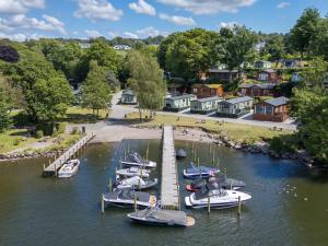 a group of boats docked at a dock in the water at Forest Pines Lodge in Bowness-on-Windermere