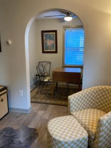 a living room with a couch and a table at The Kennywood Suite in Duquesne +22 photos