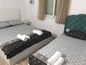 Postel nebo postele na pokoji v ubytování Meri Apartments