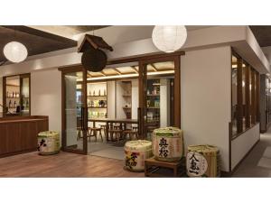a room with a table and some stools at Yuinosato Azumakan - Vacation STAY 03246v in Nihommatsu