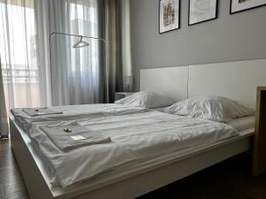 Posteľ alebo postele v izbe v ubytovaní Apartamenty Nila