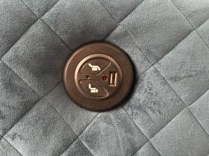 a close up of a flush button on a pillow at Group Bookings: Up To 30 Guests Across 5 Spacious Flats! Keyless Access Free Wifi & Parking in Birmingham