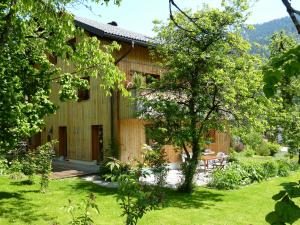 a house with a garden in front of it at Ferienwohnung Allmein Top 3 in Vandans