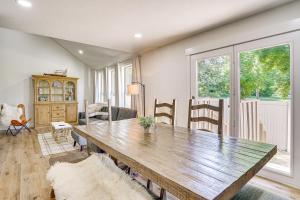 a dining room with a wooden table and chairs at Cottonwood Heights Escape Near Hiking and Skiing in Cottonwood Heights
