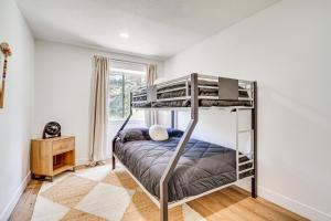 a bedroom with two bunk beds and a window at Cottonwood Heights Escape Near Hiking and Skiing in Cottonwood Heights
