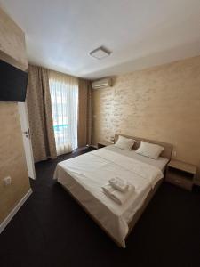 Postel nebo postele na pokoji v ubytování Complex Yavor + 16 fotografií