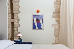 Postel nebo postele na pokoji v ubytování Il Posticino da Nonna Ida + 22 fotografií