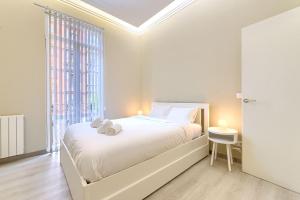 Кровать или кровати в номере Abando Station Pintxos by Next Stop Bilbao