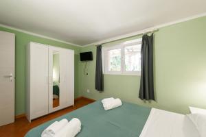 Postel nebo postele na pokoji v ubytování Villa Collina dei Pini